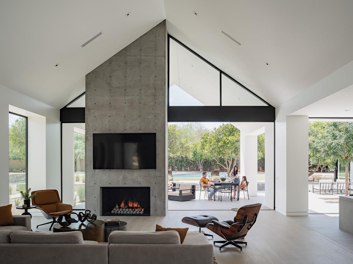 Original listing photo: living room with concrete fireplace